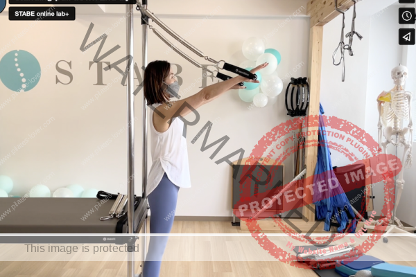 pilates exercise standing pull down